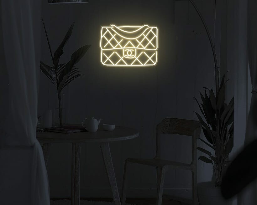 A fun and playful neon sign of a handbag for your walls