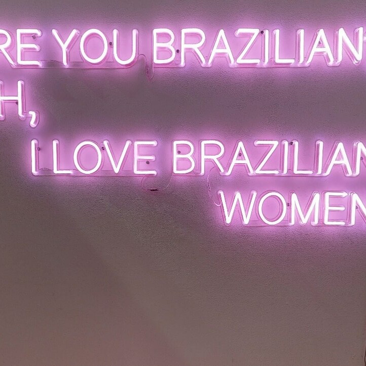 pink-neon-sign-on-wall-uai