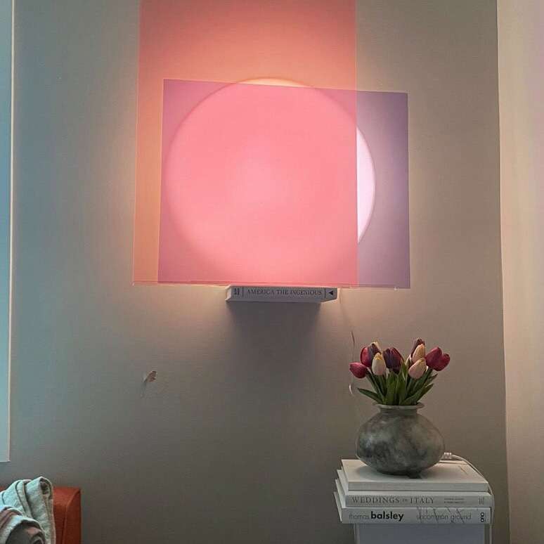 pink lune lamp on shelf